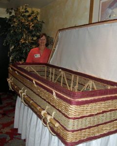 Jane Hillhouse of Final Footprint displays a wicker casket.